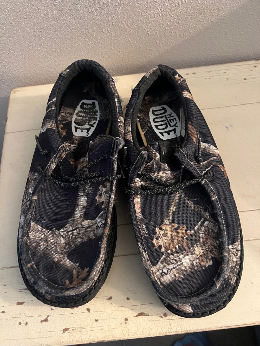 Hey Dude Kids Camo Slip-Ons in Black and Brown